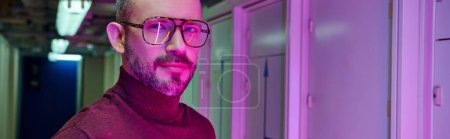 Photo for Joyful handsome professional in turtleneck with glasses smiling at camera, data center, banner - Royalty Free Image