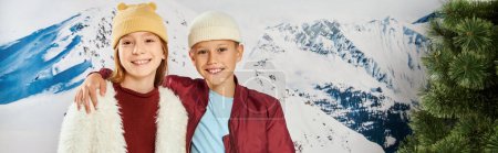 preteen boy with hand on girl shoulder smiling at camera, winter outfit, fashion concept, banner