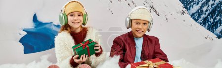 cheerful stylish peers in trendy beanie hats with presents and headsets, fashion concept, banner