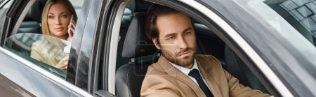 stylish bearded man driving car near attractive blonde businesswoman talking on smartphone, banner