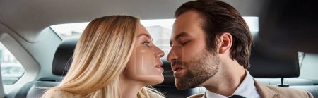 elegant businessman and attractive blonde woman sitting face to face in luxury car, banner