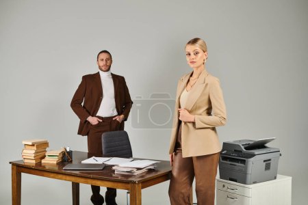 pensive beautiful woman with collected blonde hair posing next to her bearded boyfriend, work affair