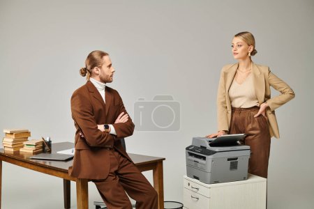 stylish bearded man with arms crossed on chest posing and looking lovingly at his blonde girlfriend
