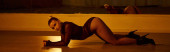 banner of woman in high heels stretching her body upon the polished floor in dancing studio puzzle #689819666
