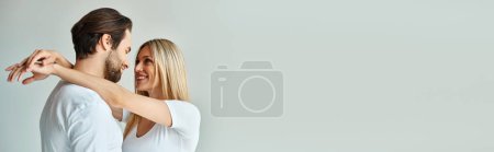 Photo for A man and a woman hold each other in an intimate moment, showcasing the romance between them, banner - Royalty Free Image