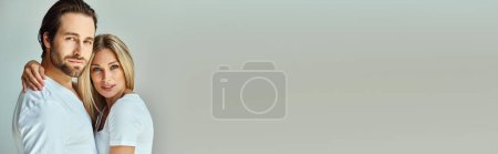 Photo for A passionate moment between a man and woman as they tightly embrace each other in a display of affection and love, banner - Royalty Free Image