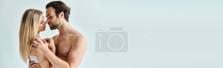 Photo for A sexy couple stands intimately together, illustrating the romance and connection between a man and a woman. - Royalty Free Image
