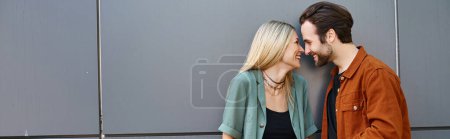 Photo for A man and woman standing side by side, exuding charm and allure as they share a special moment together. - Royalty Free Image