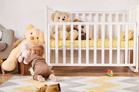 baby boy crawling on floor while playing with soft toys near crib in nursery room, happy childhood