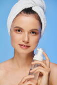 portrait of woman with towel on head and perfect skin holding dispenser with face foam on blue Longsleeve T-shirt #696260480