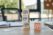 A set of wooden blocks is arranged neatly on a wooden table in a peaceful and organized manner. Stickers #697226890