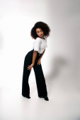 elegant attractive african american woman in fashionable attire looking at camera, fashion concept Sweatshirt #697414974