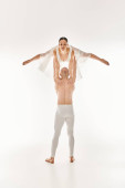 A shirtless young man supports a woman in a white dress while engaging in acrobatic dance moves. Stickers #697551598