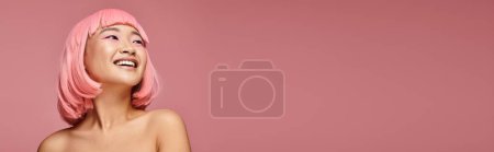 Photo for Banner of pretty asian woman with nose piercing laughing looking to up against vibrant background - Royalty Free Image
