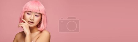 banner of asian woman with pink hair touching to chin and looking to down in vibrant background