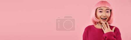 Photo for Banner of asian girl in vibrant sweater with pearl necklace expressing admiration on pink background - Royalty Free Image