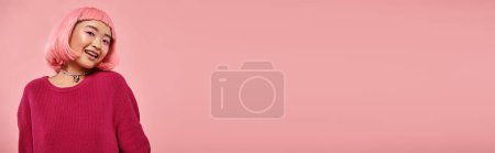 Photo for Banner, charming asian young woman with pink hair looking at camera and smiling on vibrant backdrop - Royalty Free Image