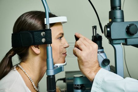 A woman undergoing eye examination by a man in a doctors office.