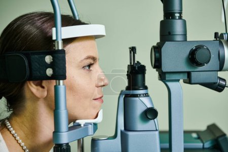 Beautiful female patient checking her vision.