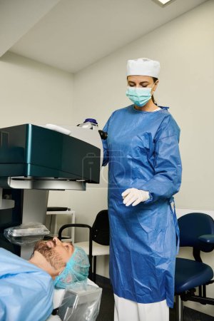 A woman in a surgical gown stands in a room at a doctors office.