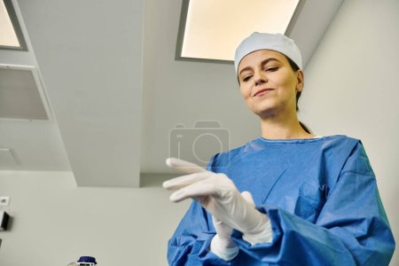 Appealing doctor in a hospital gown and white gloves operating laser vision correction.