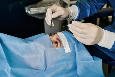 Surgeon wearing mask performing laser vision correction on womans face.