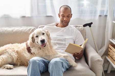 A man with myasthenia gravis relaxes at home on a couch with his loyal Labrador dog, engrossed in a good book.