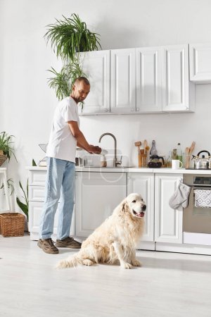 An African American man with myasthenia gravis stands next to his Labrador dog in a cozy kitchen, sharing a moment of connection.