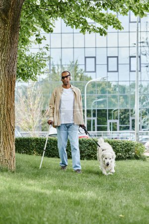 An African American man with myasthenia gravis syndrome walking his Labrador dog on a leash.