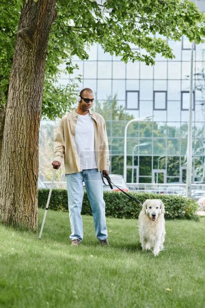 An African American man with myasthenia gravis syndrome walking his white Labrador dog on a leash in a diverse and inclusive city park.