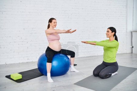 pregnant woman, guided by her coach, perform exercises on exercise balls during a prenatal fitness session.