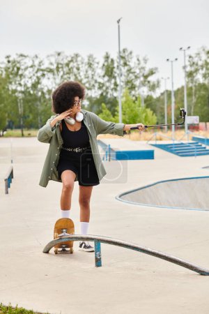 A young African American woman with curly hair skillfully rides a skateboard along a rail in a vibrant outdoor skate park.