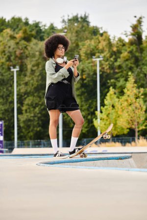 Young African American woman with curly hair confidently standing on a skateboard in a vibrant skate park setting.