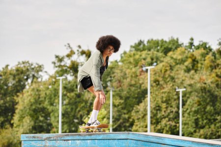 A young African American woman with curly hair gracefully rides her skateboard on a ramp at an outdoor skate park.