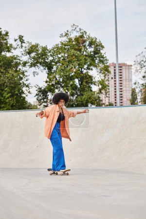A young African American woman with curly hair confidently rides a skateboard down a challenging cement ramp in a skate park.