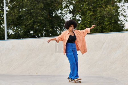 A young African American woman with curly hair confidently rides a skateboard at a vibrant skate park.