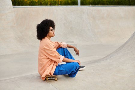 A young African American woman with curly hair confidently sits on a skateboard at a busy skate park, ready to glide.