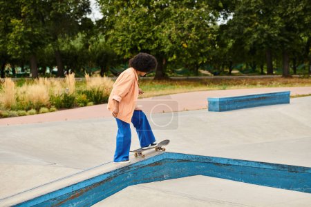 Young African American woman confidently rides his skateboard on a ramp with skill and determination.