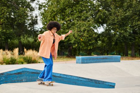 A young African American woman with curly hair fearlessly rides a skateboard on top of a ramp in a vibrant skate park.