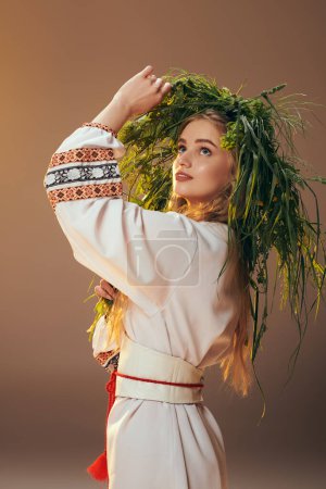 A young woman in traditional attire wears an ornate wreath in a studio setting, embodying fairy and fantasy elements.
