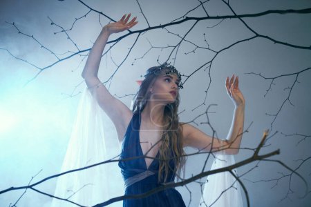 Une jeune femme vêtue d'une robe bleue se tenant gracieusement devant un arbre majestueux, respirant un air de fantaisie et de magie.