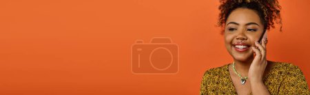 Photo for Stylish African American woman exudes joy with a beautiful smile on a vibrant backdrop. - Royalty Free Image