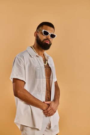 A bearded man exudes cool in sunglasses and a stylish shirt, embodying charm and confidence in his appearance.
