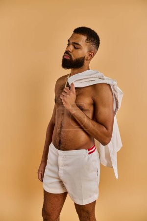 A man with a full beard stands shirtless in a tranquil setting, connecting with nature through his bare chest.