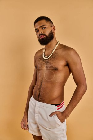 A man with a full beard stands confidently, sporting white shorts. His beard adds a rugged touch to his relaxed and casual outfit.