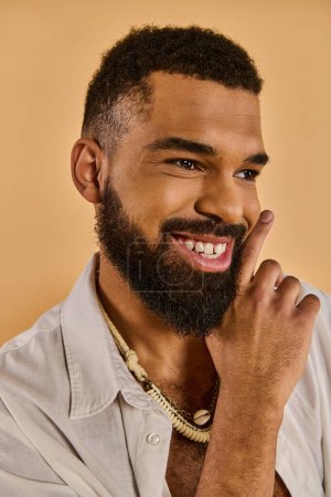 A close-up view of a stylish man with a striking beard, showcasing his unique facial hair and masculine features.