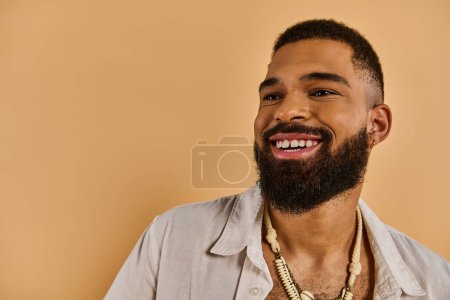 A man with a luxurious beard adorns his neck with a captivating necklace, showcasing a unique and elegant style.