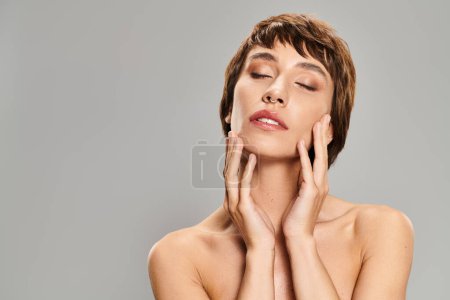 Photo for A woman expressing emotions with her hands on her face. - Royalty Free Image