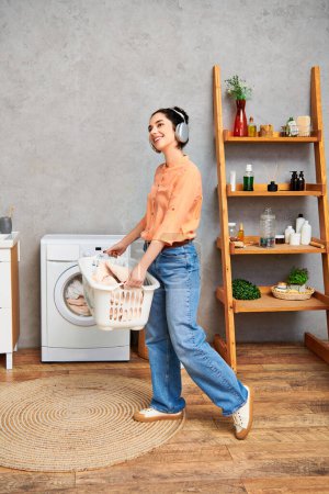 A stylish woman in casual attire happily holds a laundry basket, radiating positivity and energy.