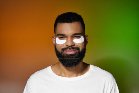 Photo for Handsome man with eye patches on his face. - Royalty Free Image
